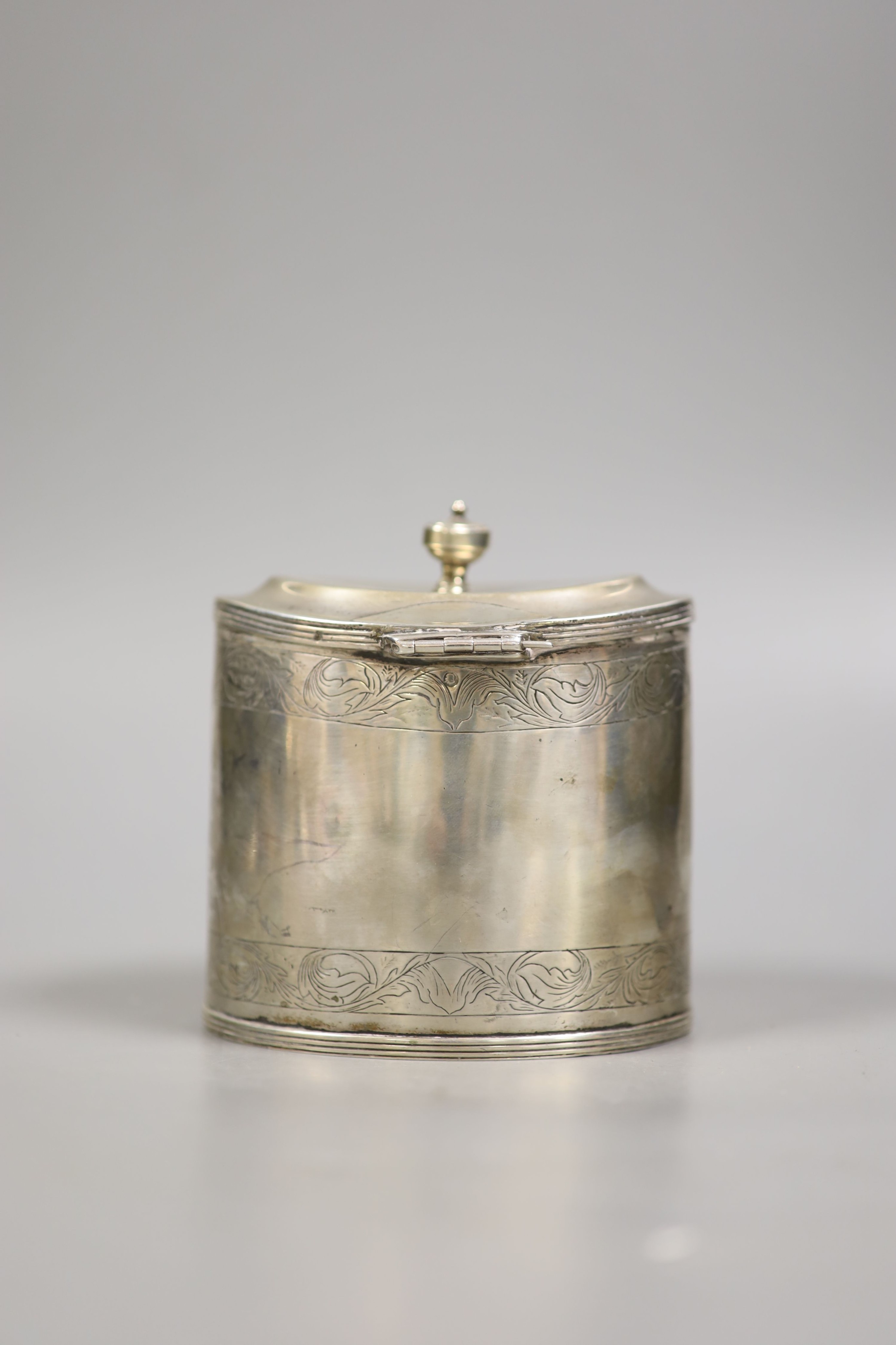 A 19th century Dutch white metal oval tea caddy, height 11.3cm, with lock, no key, 9oz.